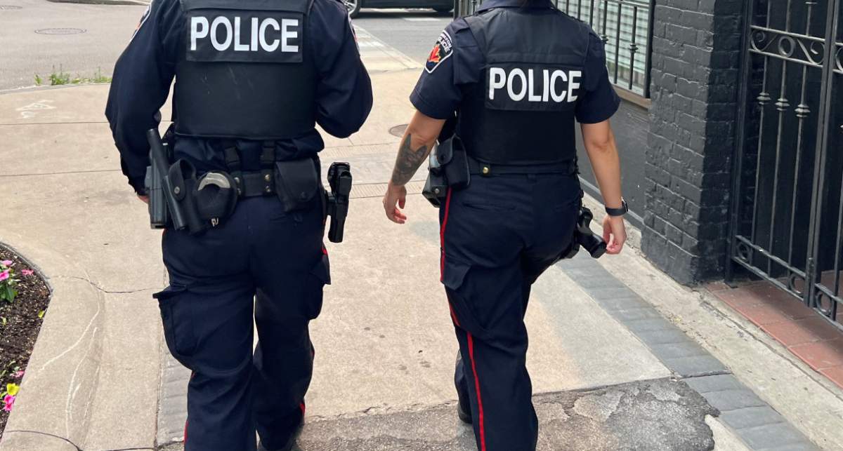 Two Hamilton police officers walking the beat on King Street East.