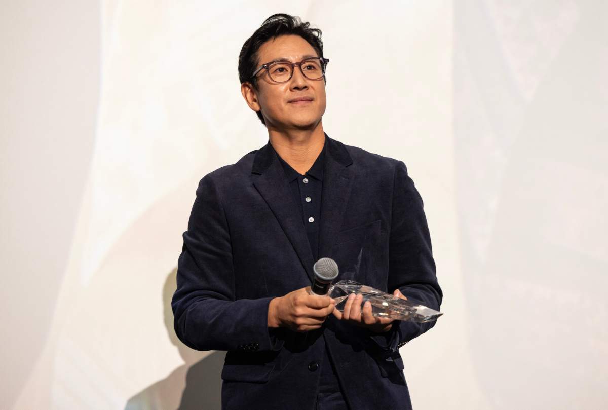 Actor Lee Sun-kyun receives the award for "Excellent Achievement in Film" during the introduction of the "Killing Romance" Midwest premiere at AMC New City 14 on October 07, 2023 in Chicago, Illinois.