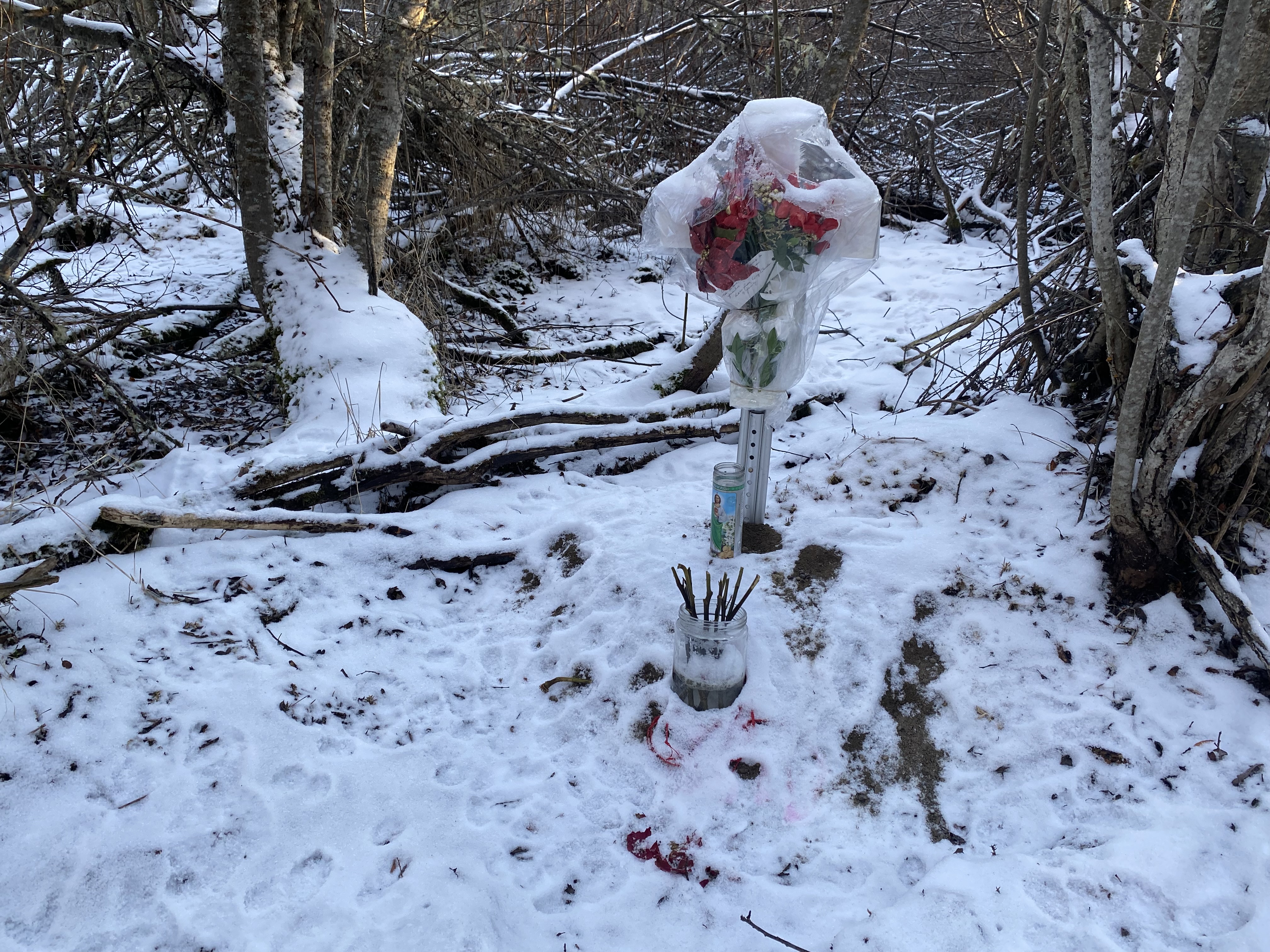 A memorial is displayed in the snow
