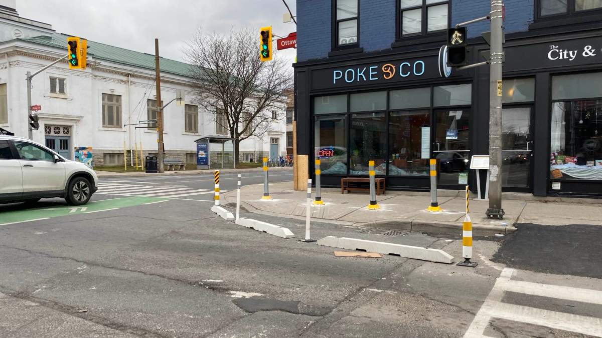 A photo of new bollards and road bump-outs installed in December 2023 to improve safety at a misaligned intersection in Hamilton. Ont.