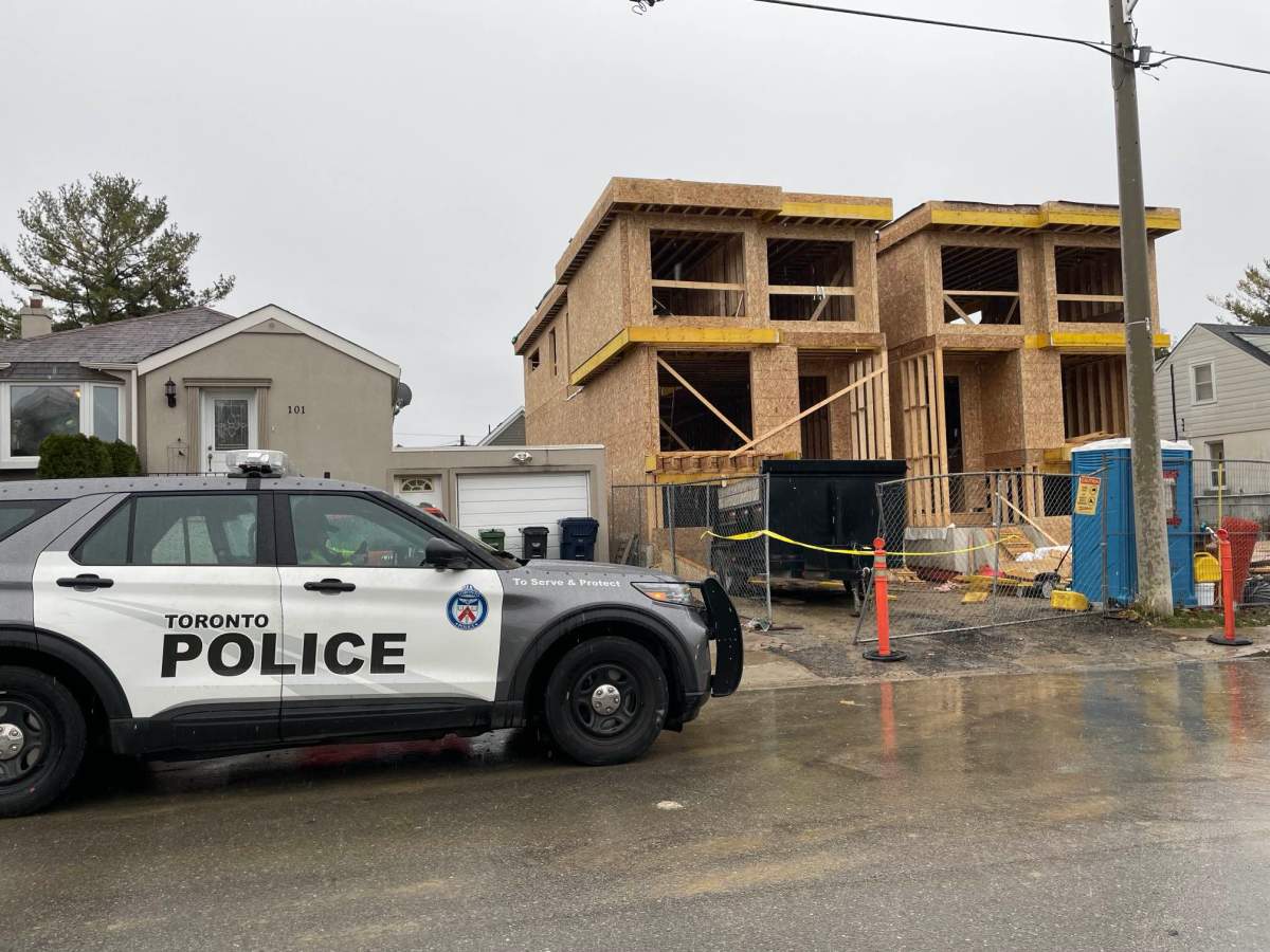 Police at the scene following a fatal work accident in Toronto on Dec. 1, 2023.
