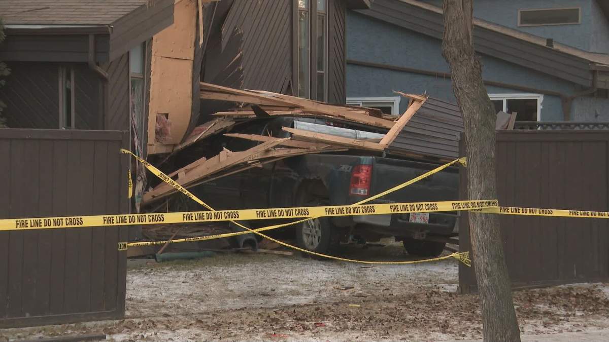 A truck crashed into a house in St. Albert, Alta., on Dec. 22, 2023.