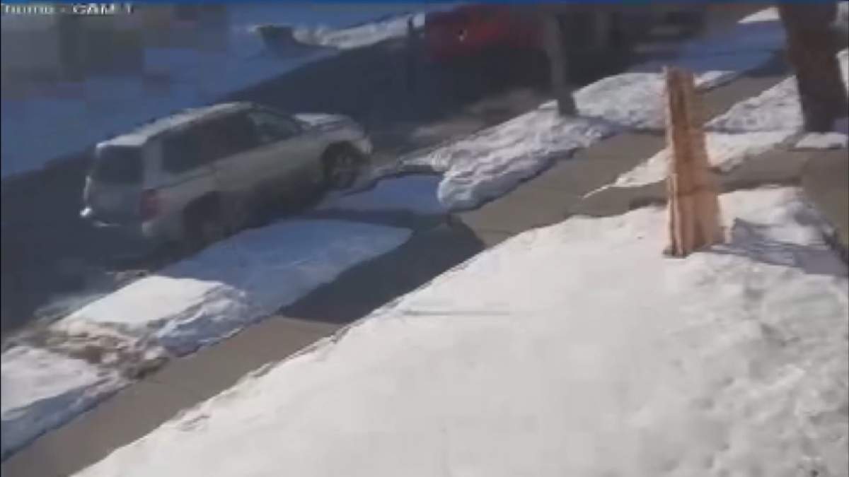Surveillance image of the moments before a man was fatally struck by a vehicle along Temple Drive Northeast on Dec. 12, 2023.