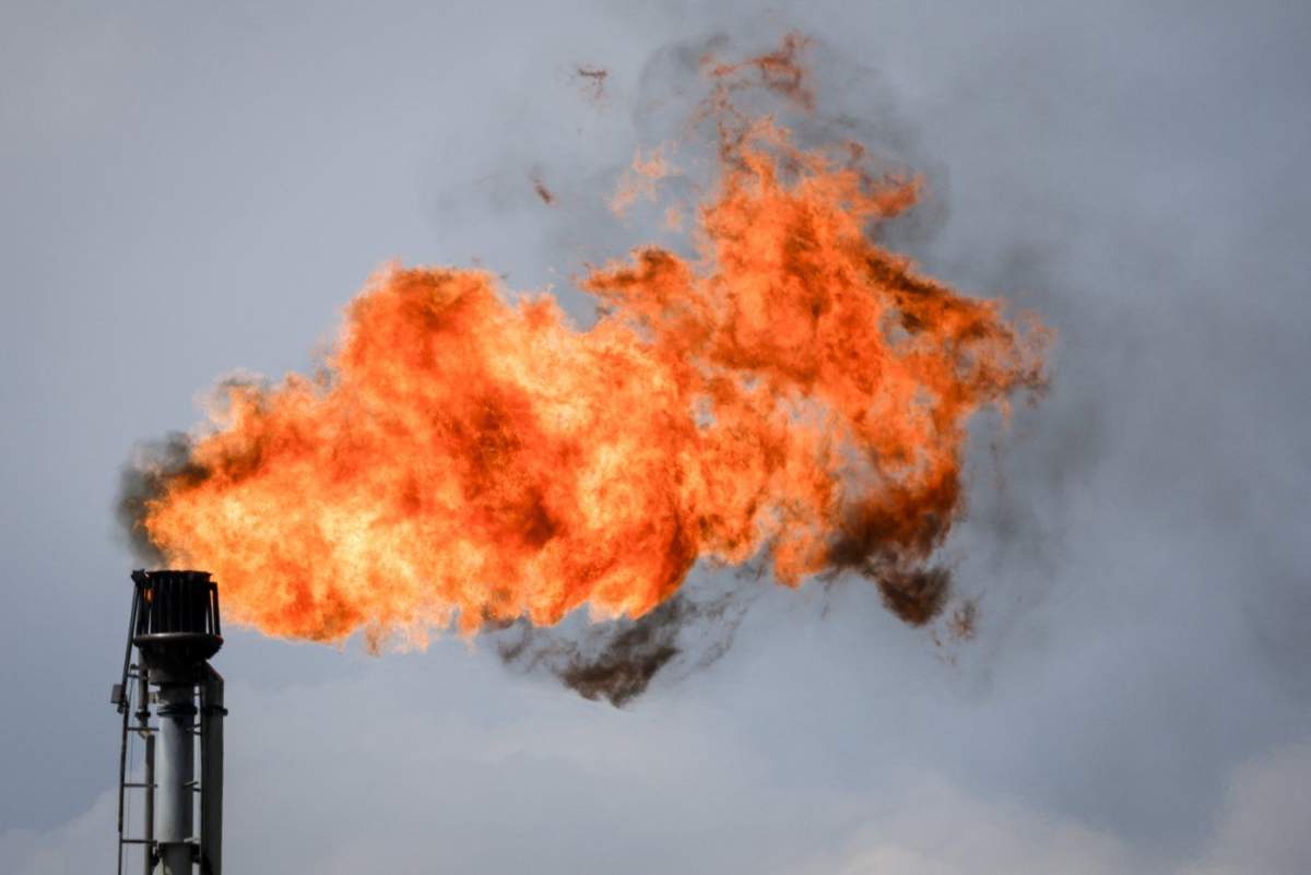 A flare stack burns off excess gas at a processing facility near Crossfield, Alta., Tuesday, June 13, 2023. Canada's oil and gas industry says the emissions cap framework announced Thursday by Ottawa could result in significant production curtailments by companies.