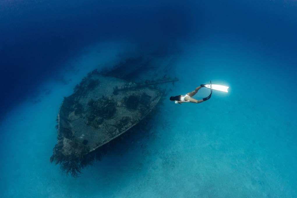 Kim Bruneau is photographed by Pia Oyarzun in a record-breaking deep sea photoshoot in Nassau, Bahamas.