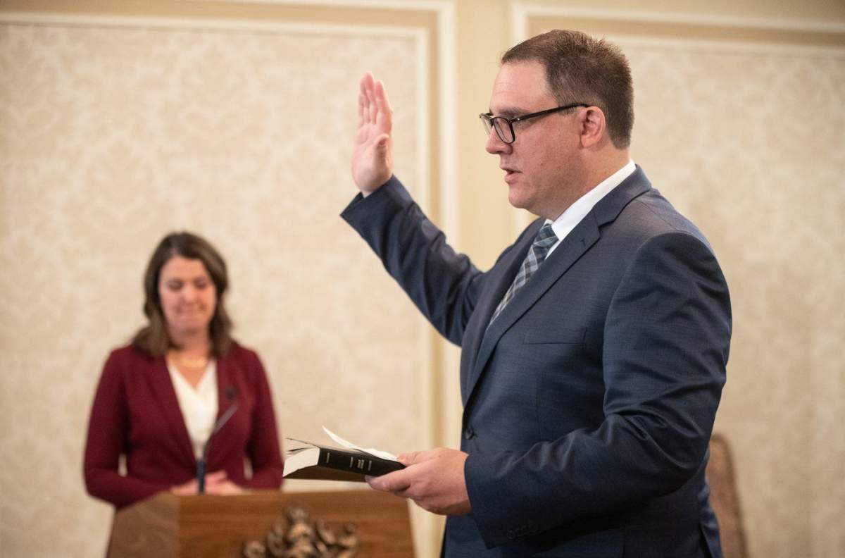 Alberta cabinet minister Jason Nixon says he will be taking some time to focus on family after his two youngest children were involved in a car crash. Nixon is sworn into cabinet, in Edmonton, Friday, June 9, 2023. 