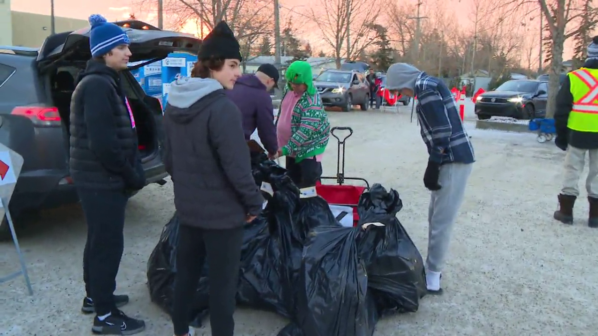Hundreds of volunteers turn out for delivery day at 630 CHED Santas Anonymous.