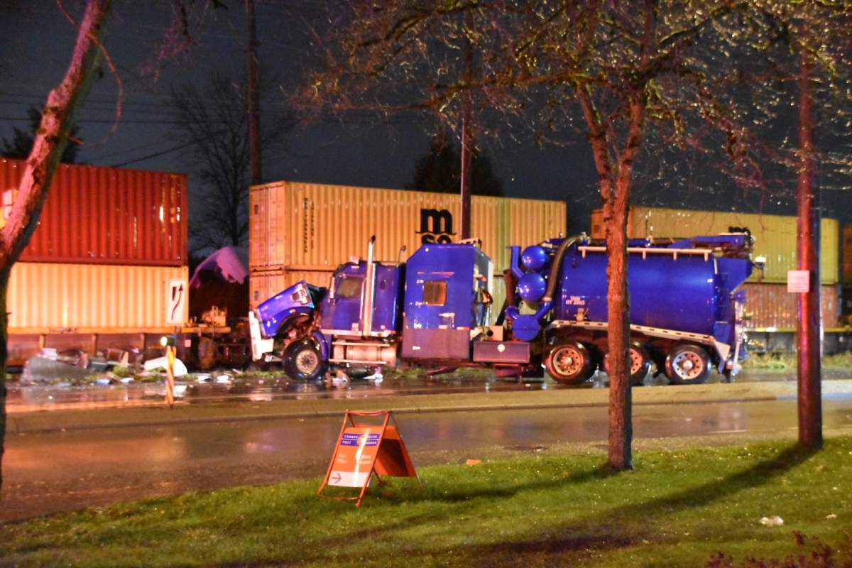 A vacuum truck and a train collided early Saturday morning in Langley, B.C.