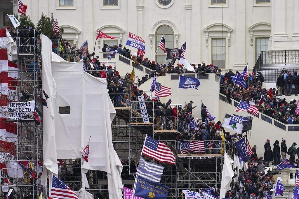In this Jan. 6, 2021 file photo insurrectionists loyal to President Donald Trump riot outside the Capitol in Washington.
