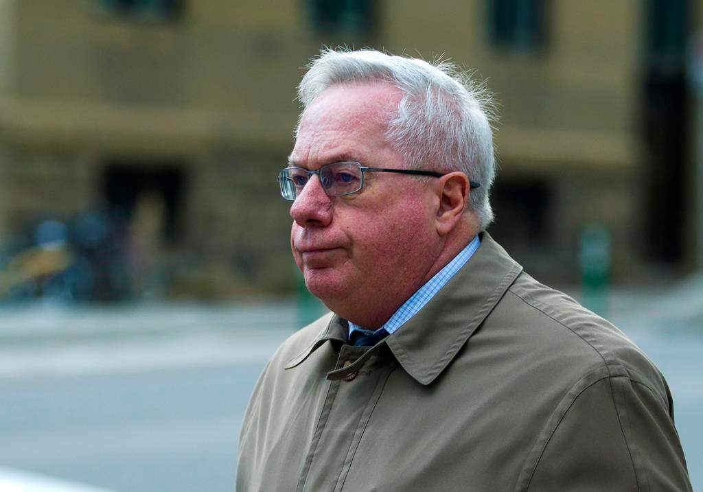 Retired neurologist Keith Hoyte leaves the courthouse in Calgary, Monday, Jan. 6, 2020. Hoyte has been sentenced to three years in prison for sexually assaulting dozens of patients over a three decade period.