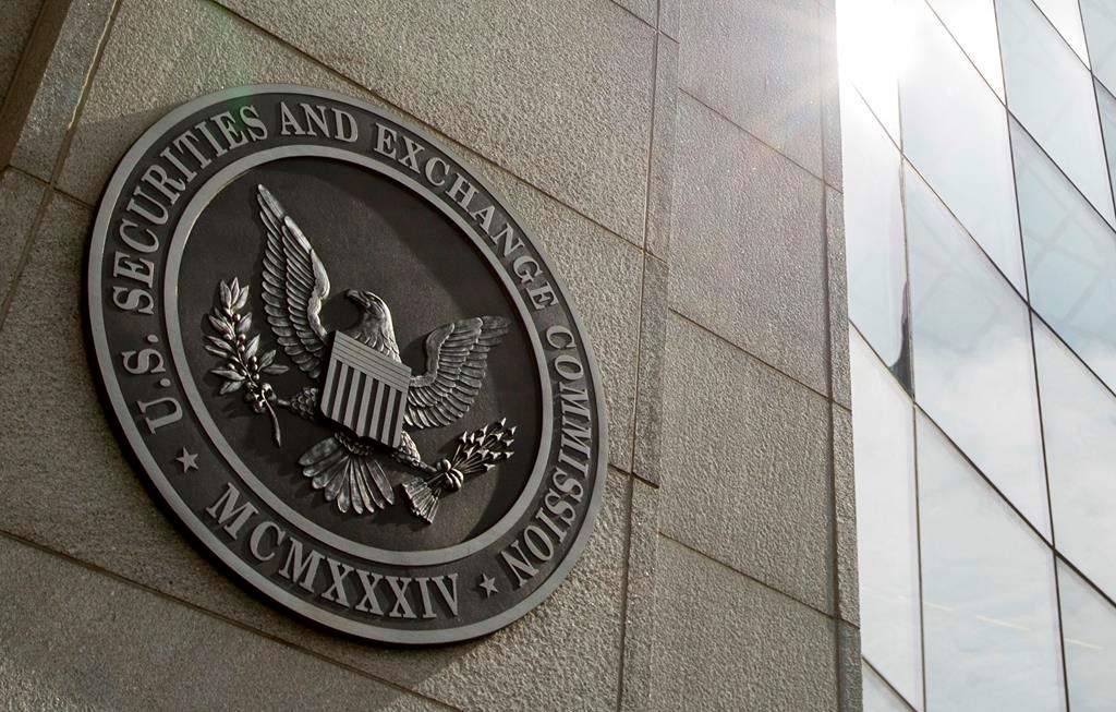 FILE - The seal of the U.S. Securities and Exchange Commission at SEC headquarters, June 19, 2015, in Washington. The Securities and Exchange Commission said Tuesday, Jan. 9, 2024, that a post on X, formerly known as Twitter, announcing that the securities regulator had approved the trading of exchange-traded funds holding bitcoin was fake, and that the agency’s account had been “compromised.” (AP Photo/Andrew Harnik, File).