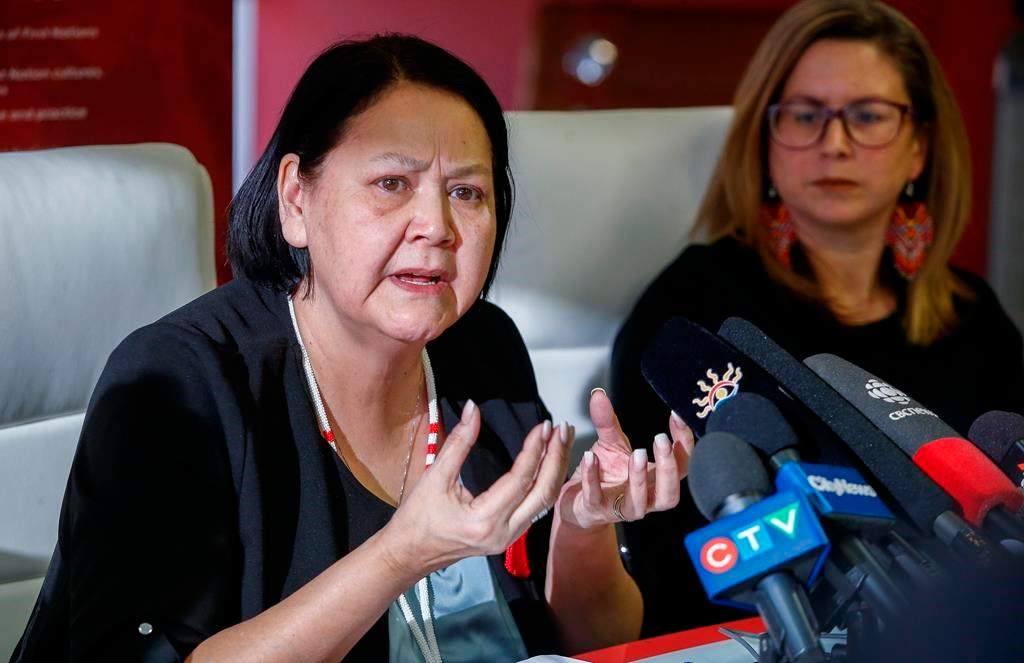 The Assembly of Manitoba Chiefs says a second feasibility study assessing the scope of a landfill search for the remains of two First Nations women has been completed and is set to be forwarded to the federal government. Kirstin Witwicki, right, cousin of Morgan Harris, listens in as Cathy Merrick, Grand Chief of the Assembly of Manitoba Chiefs, speaks to media in response to a federal announcement for a feasibility study to search a local landfill in Winnipeg, Friday, Feb. 10, 2023. 