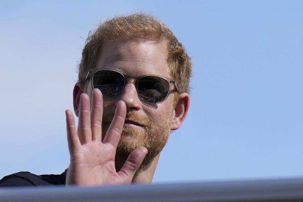 Britain's Prince Harry, The Duke of Sussex, waves during the Formula One U.S. Grand Prix auto race at Circuit of the Americas, on Oct. 22, 2023, in Austin, Texas.