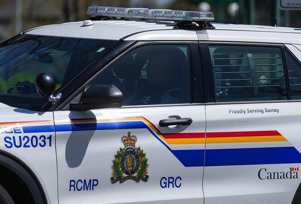 A Surrey RCMP officer drives a police vehicle in Surrey, B.C., on Friday, April 28, 2023.