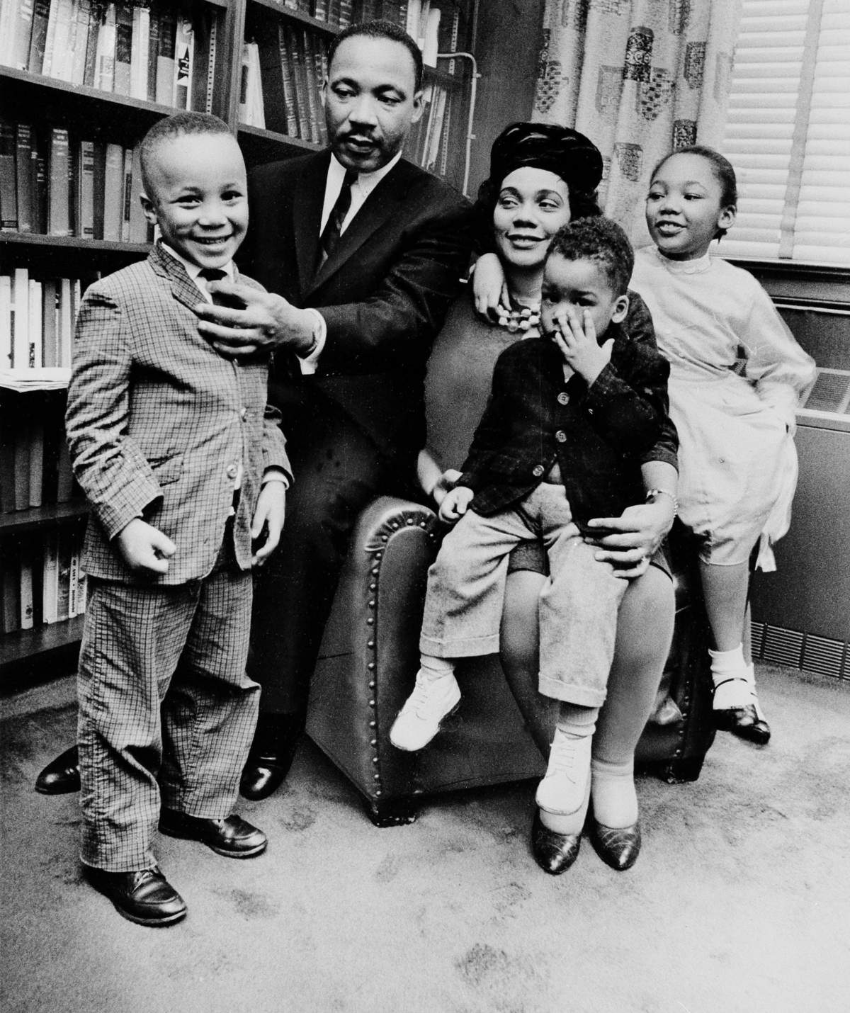 Black and white photo taken on March 17, 1963 of Dr. Martin Luther King Jr. and his wife, Coretta Scott King, as they sit with three of their four children in their Atlanta, Ga., home. From left are: Martin Luther King III, 5, Dexter Scott, 2, and Yolanda Denise, 7.