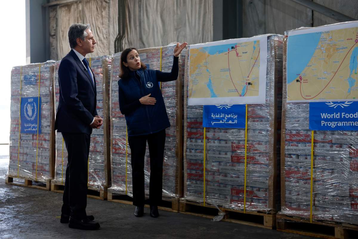 U.S. Secretary of State Antony Blinken, left, visits a World Food Program (WFP) regional warehouse in Amman, Jordan Sunday, Jan. 7, 2024.