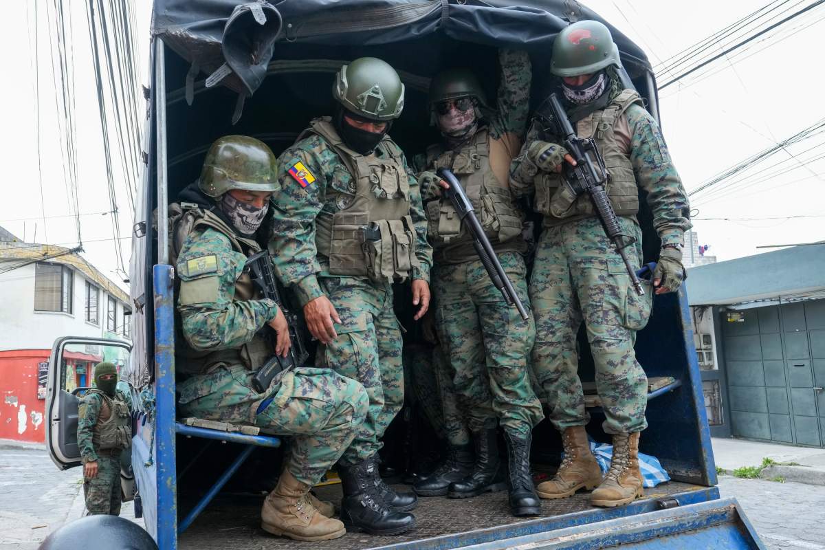Soldiers patrol the perimeter of Inca prison during a state of emergency in Quito, Ecuador, Tuesday, Jan. 9, 2024, in the wake of the apparent escape of a powerful gang leader from prison. President Daniel Noboa decreed Monday a national state of emergency, a measure that lets authorities suspend people’s rights and mobilize the military in places like the prisons. The government also imposed a curfew from 11 p.m. to 5 a.m. (AP Photo/Dolores Ochoa)