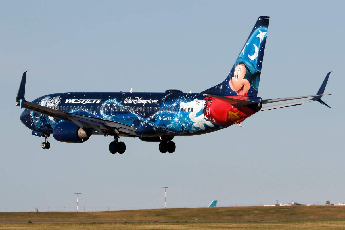 A Boeing 737 (737-800) jetliner belonging to WestJet Airlines and in Disney livery lands in Calgary, Alberta on Aug. 28, 2022. 