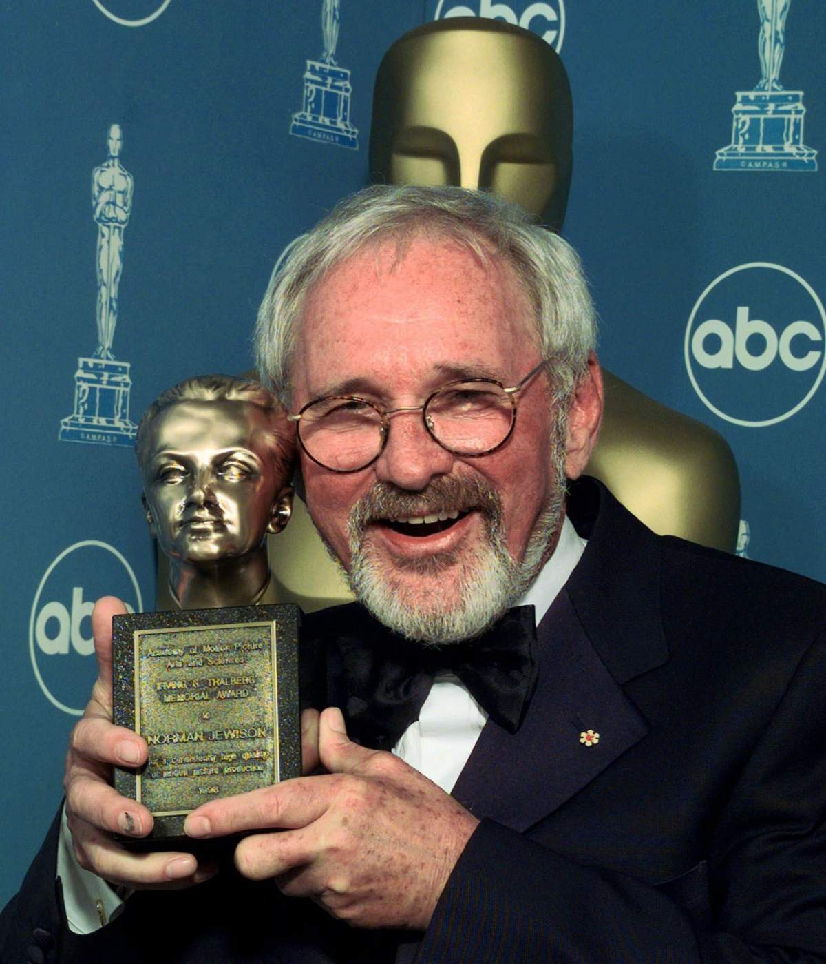 Norman Jewison celebrates after winning the Irving Thalberg Award, in recognition of his consistent high quality of motion picture production, during the 71st Annual Academy Awards Sunday, March 21, 1999, at the Dorothy Chandler Pavilion of the Los Angeles Music Center. (AP Photo/Reed Saxon)