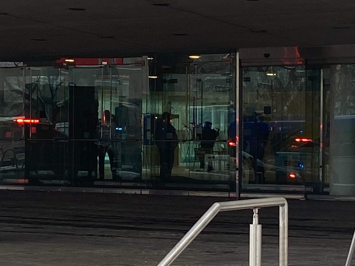 Emergency crews are seen at Edmonton City Hall on Tuesday, Jan. 23, 2024 after people reported hearing loud bangs. Police said they were investigating a weapons complaint.