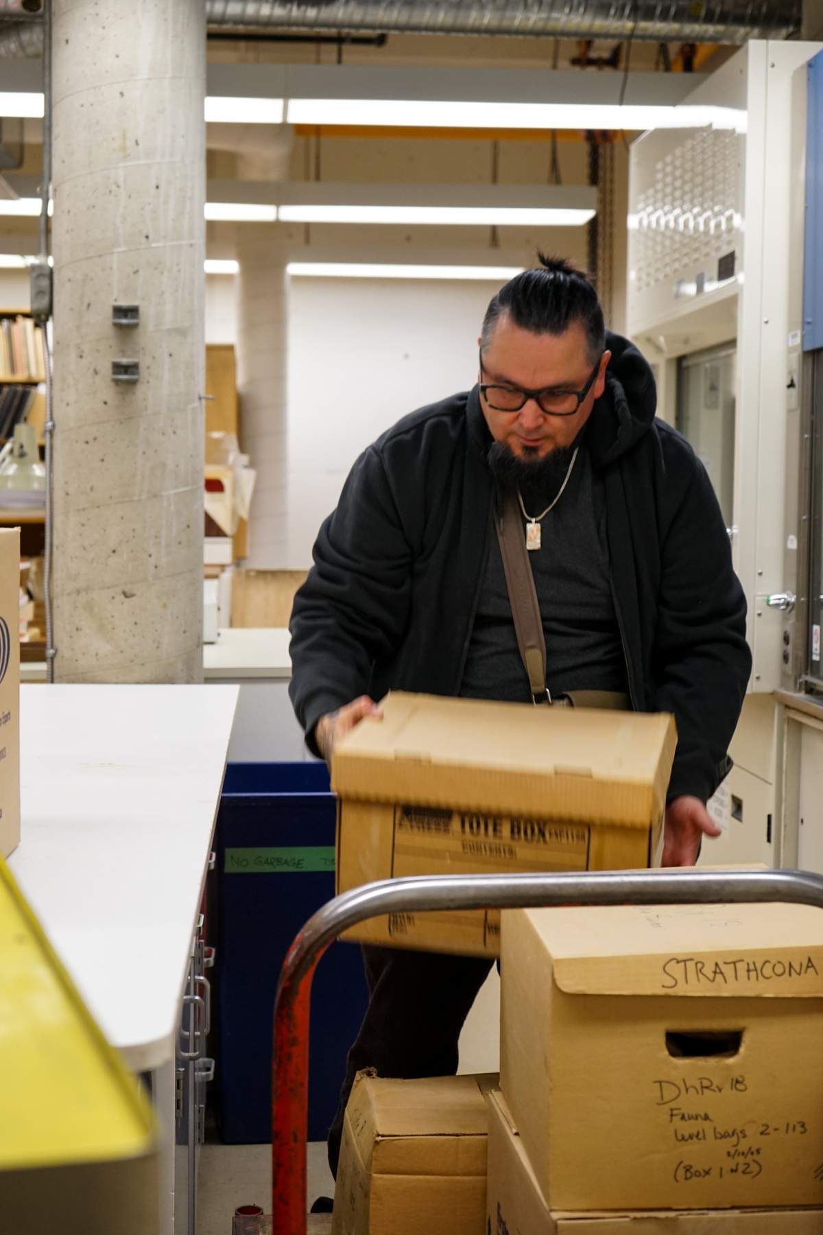 A man holds a cardboard box.