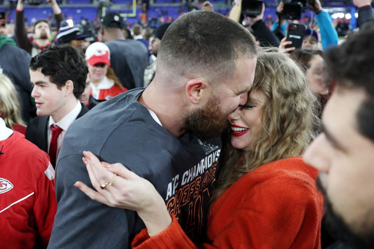 Travis Kelce #87 of the Kansas City Chiefs celebrates with Taylor Swift after a 17-10 victory against the Baltimore Ravens in the AFC Championship Game at M&T Bank Stadium on January 28, 2024 in Baltimore, Maryland.