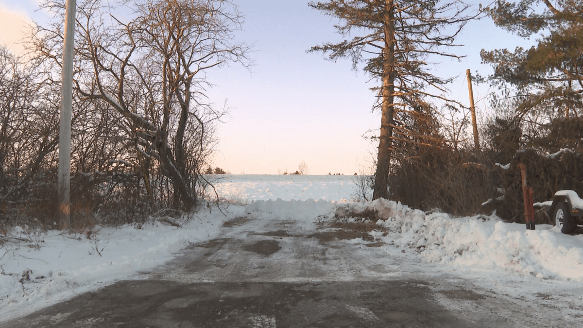 The property is situated behind several houses and businesses on a road within the town limits.