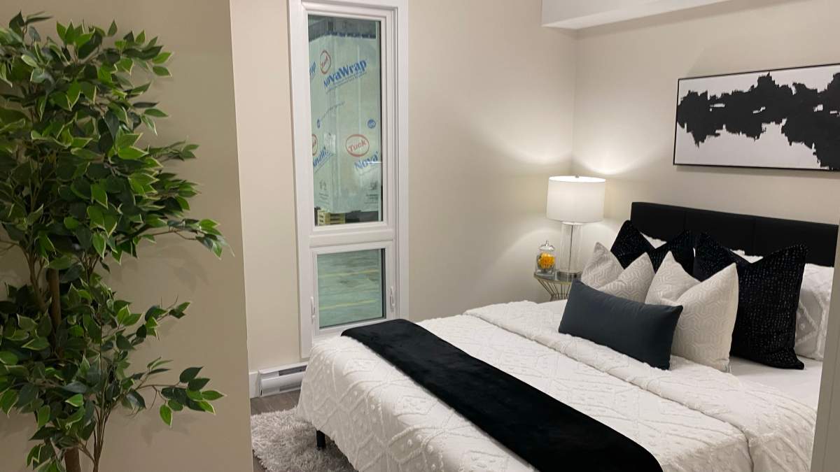 A photo of a bedroom from a modular home residing in warehouse at BECC modular in Ancaster, Ont.