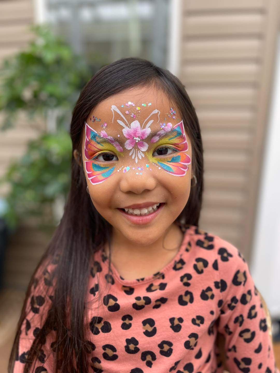 Photo showing Julia's Jubilant Face Painting.