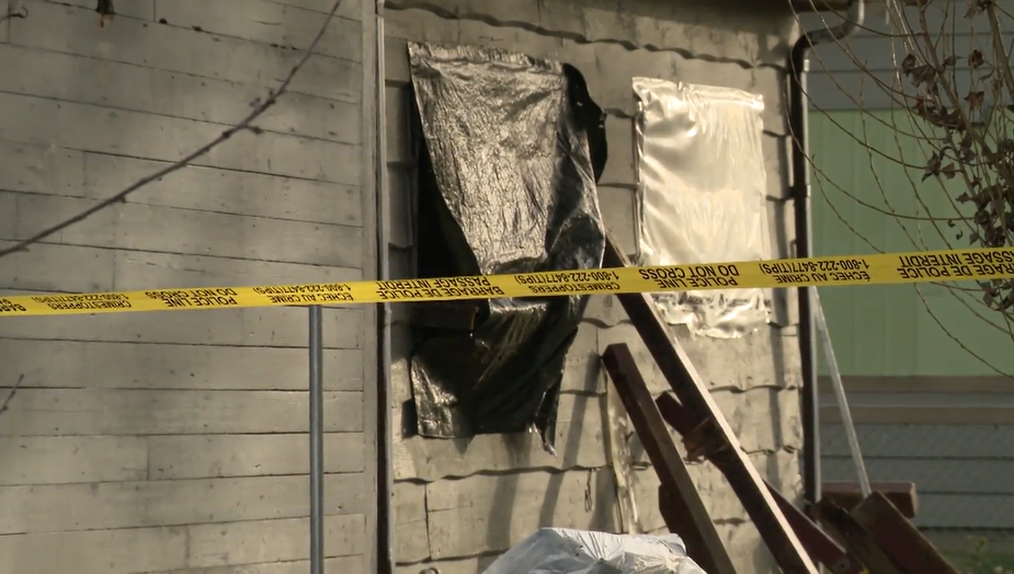 Yellow police tape is seen outside a Ritchie Avenue home in Maple Ridge, B.C. where a man was shot on Mon. Jan. 15, 2024.