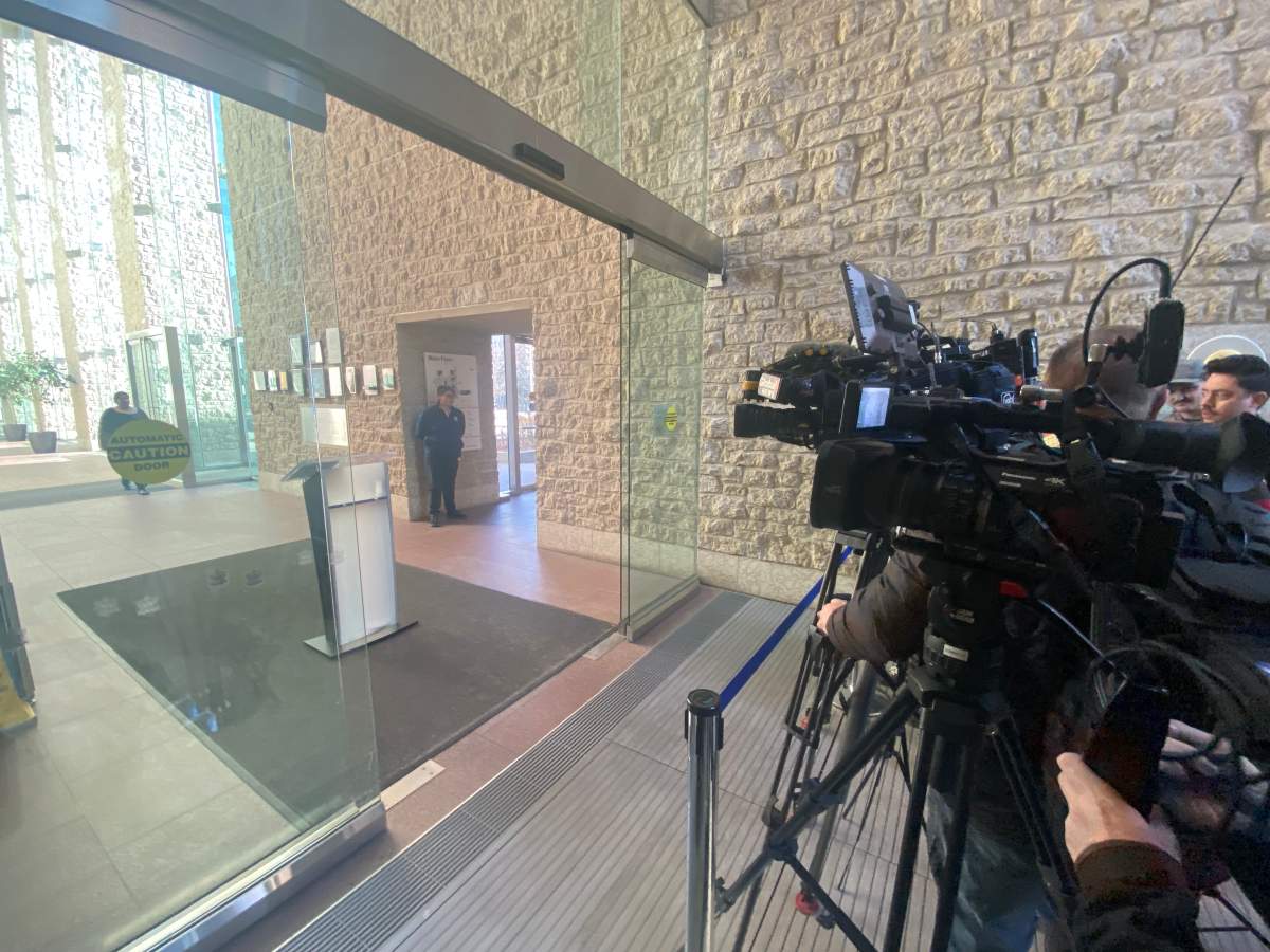A news conference in the doorway of Edmonton City Hall on Tuesday, January 30, 2024.