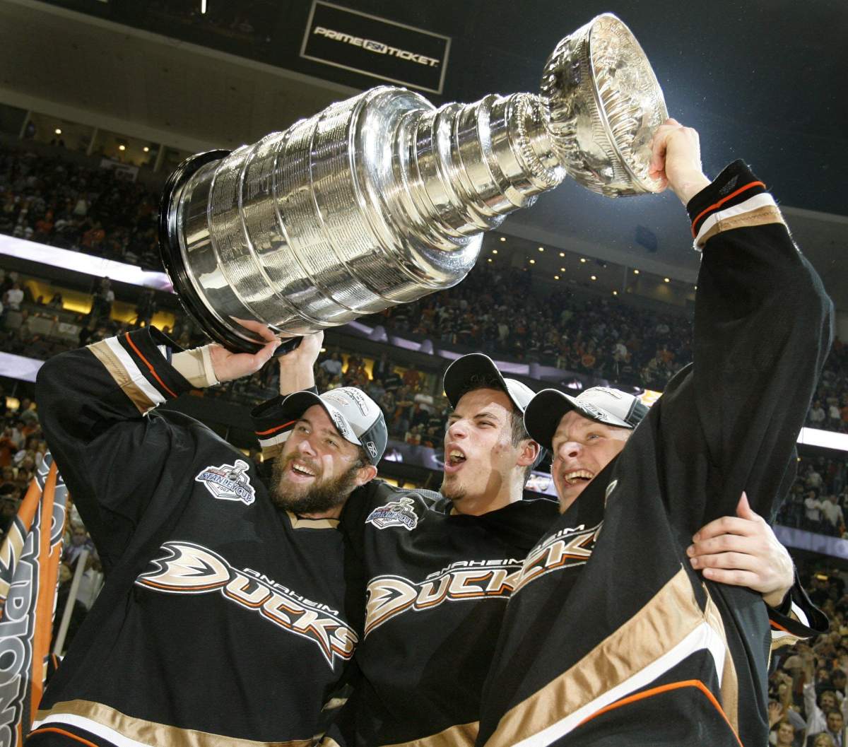 Anaheim Ducks players Dustin Penner (left), Ryan Getzlaf (centre), and Corey Perry (right) hold up the Stanley Cup after the Ducks won the finals with a 6-2 victory over the Ottawa Senators in Anaheim, Calif. Wednesday, June 6, 2007.