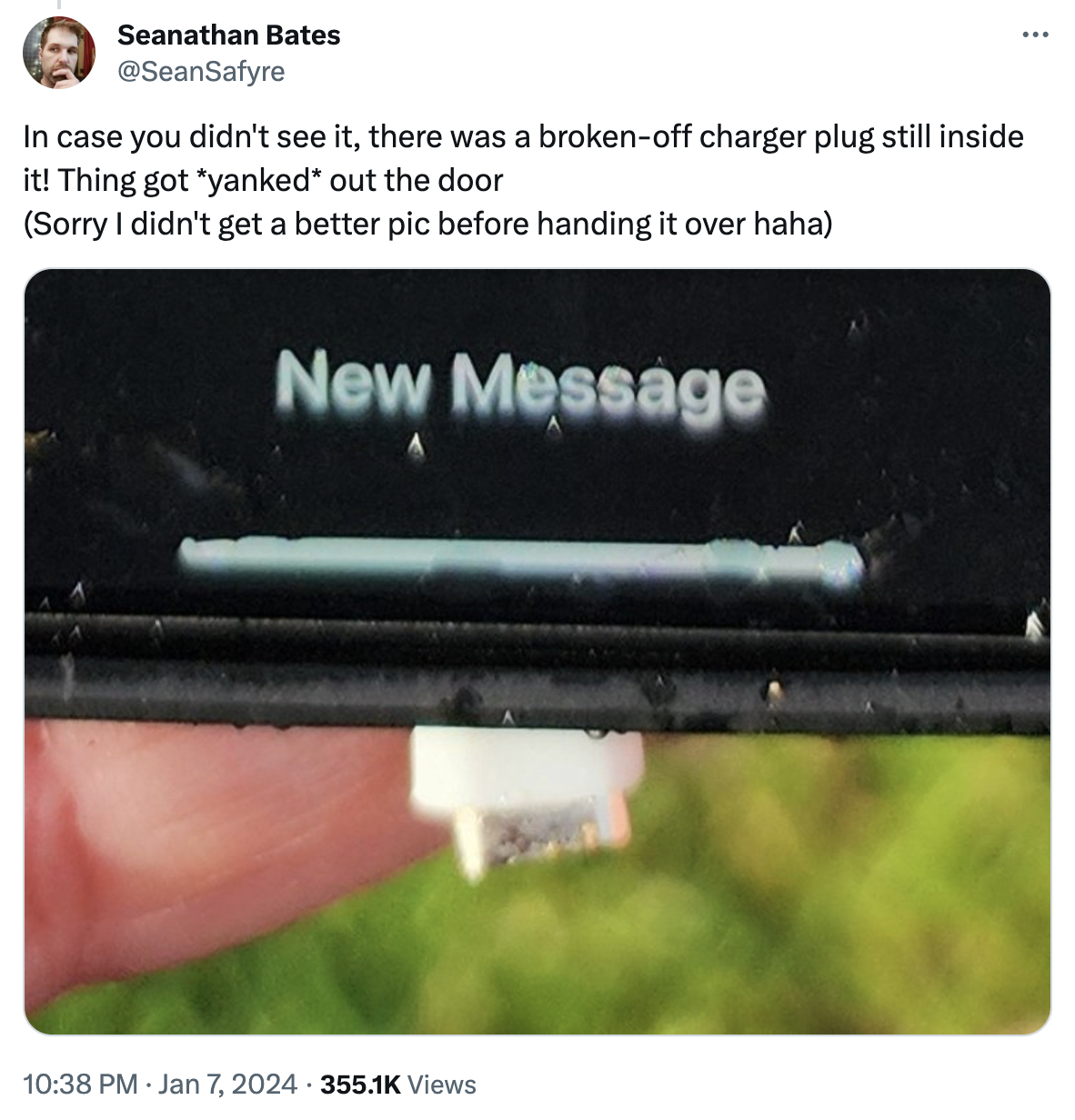 Screengrab of a social media post showing a small piece of an iPhone charger stuck inside the port after the phone appeared to have been sucked out of Alaska Airlines flight 1282.