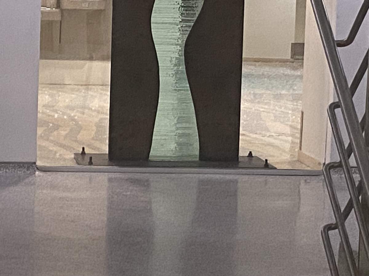 Shattered glass on the floor of Edmonton City Hall Wednesday, Jan. 24, 2024, one day after a shooting inside the building.