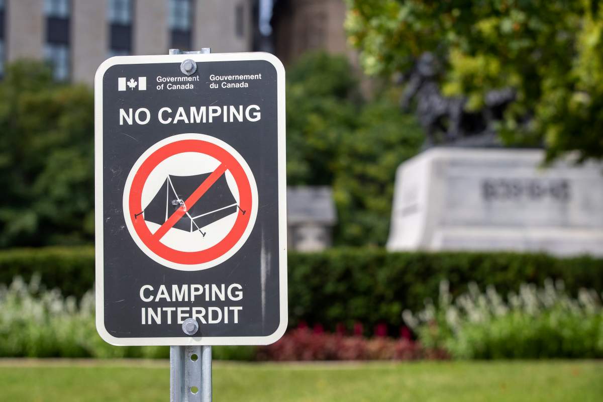 A sign warns no camping allowed near the National War Memorial in Ottawa, Canada.