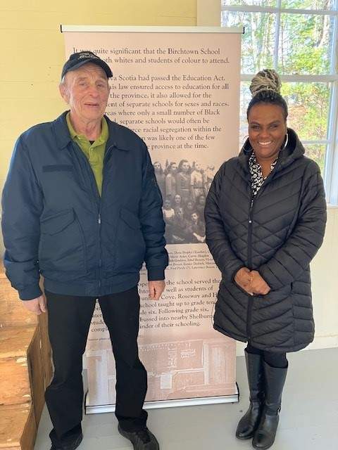 Darrell Acker, a former student at the Birchtown schoolhouse, alongside the executive director of the Black Loyalist Heritage Society