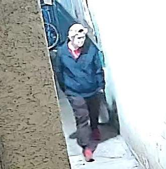 Police have released photos of a man, they describe as a suspect in the case, who was captured on security video in the area. 