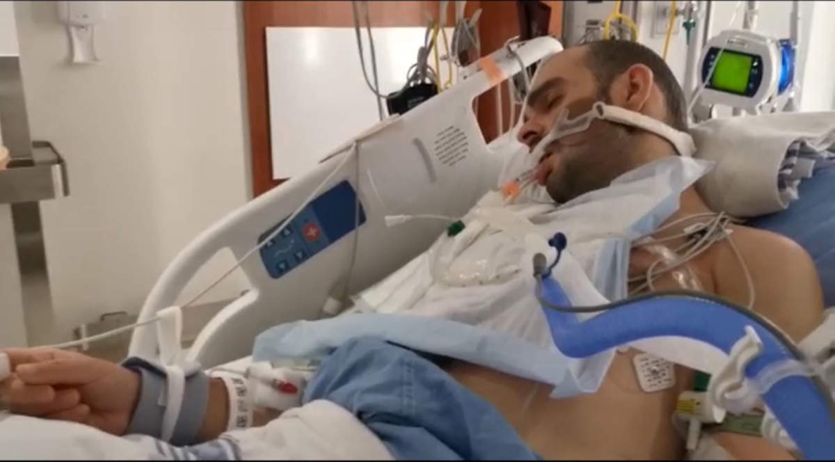 man in hospital bed