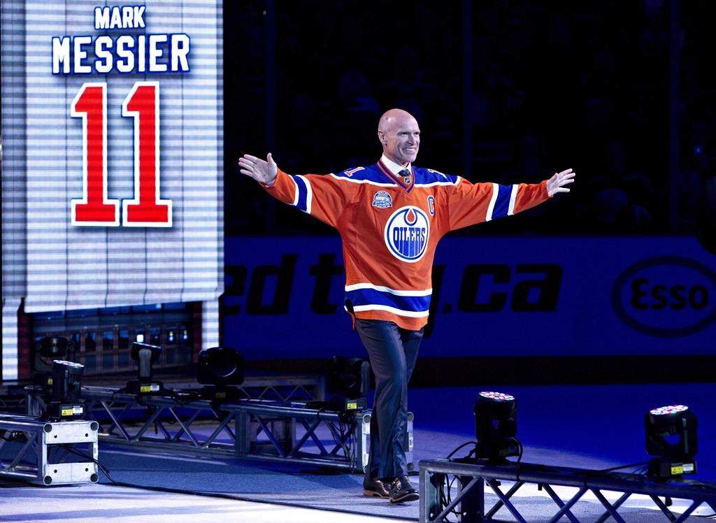 Former player Mark Messier waves to the crowd during the Edmonton Oilers farewell ceremony at Rexall Place in Edmonton, Alta., on Wednesday April 6, 2016.