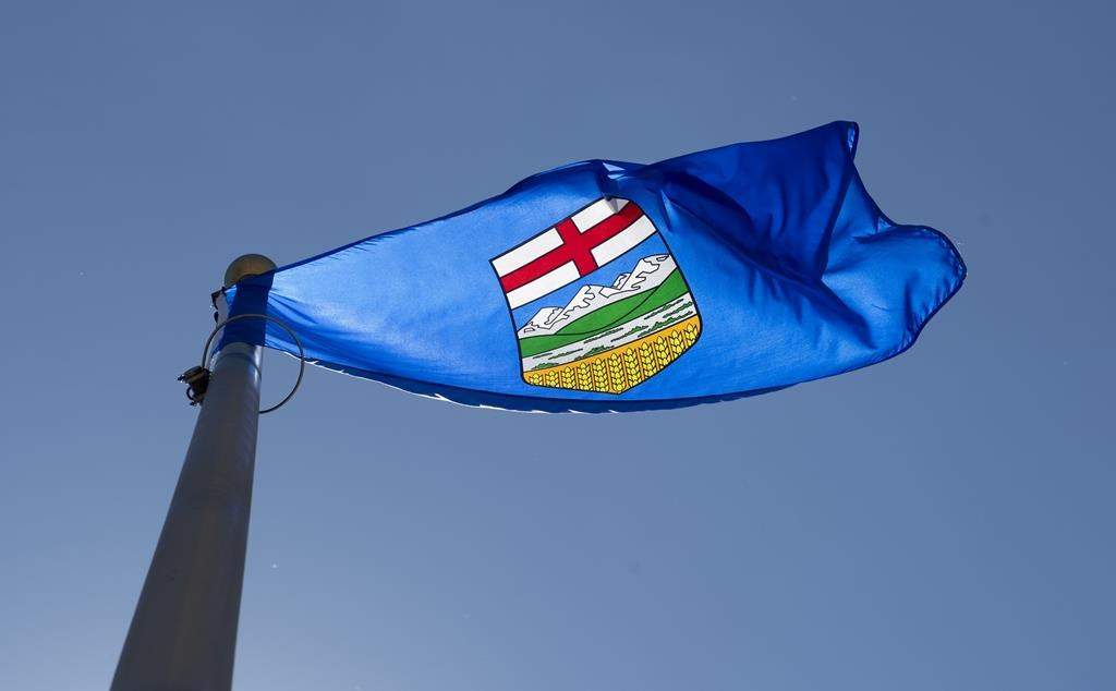An Alberta power generator has been fined for running a power plant without regulatory approval. Alberta's provincial flag flies in Ottawa, Monday July 6, 2020.