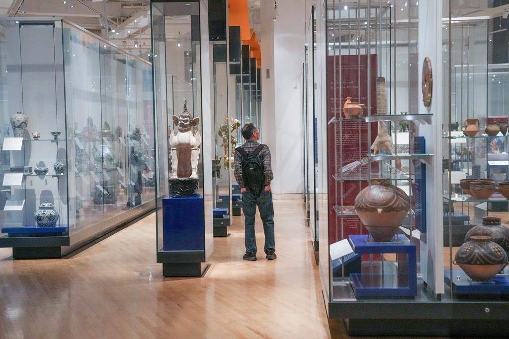 The Royal Ontario Museum will redesign and expand the galleries on its first floor, which it says will be free for all. A visitor explores a gallery at the Royal Ontario Museum in Toronto on Tuesday, Dec. 12, 2023. THE CANADIAN PRESS/Chris Young.