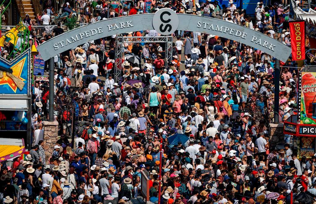 A former member of a youth performance group run by the Calgary Stampede says he expects he'll feel on guard now that day parole has been granted to the man who sexually abused teens over three decades. Crowds at the Calgary Stampede parade in Calgary, Sunday, July 9, 2023. THE CANADIAN PRESS/Jeff McIntosh