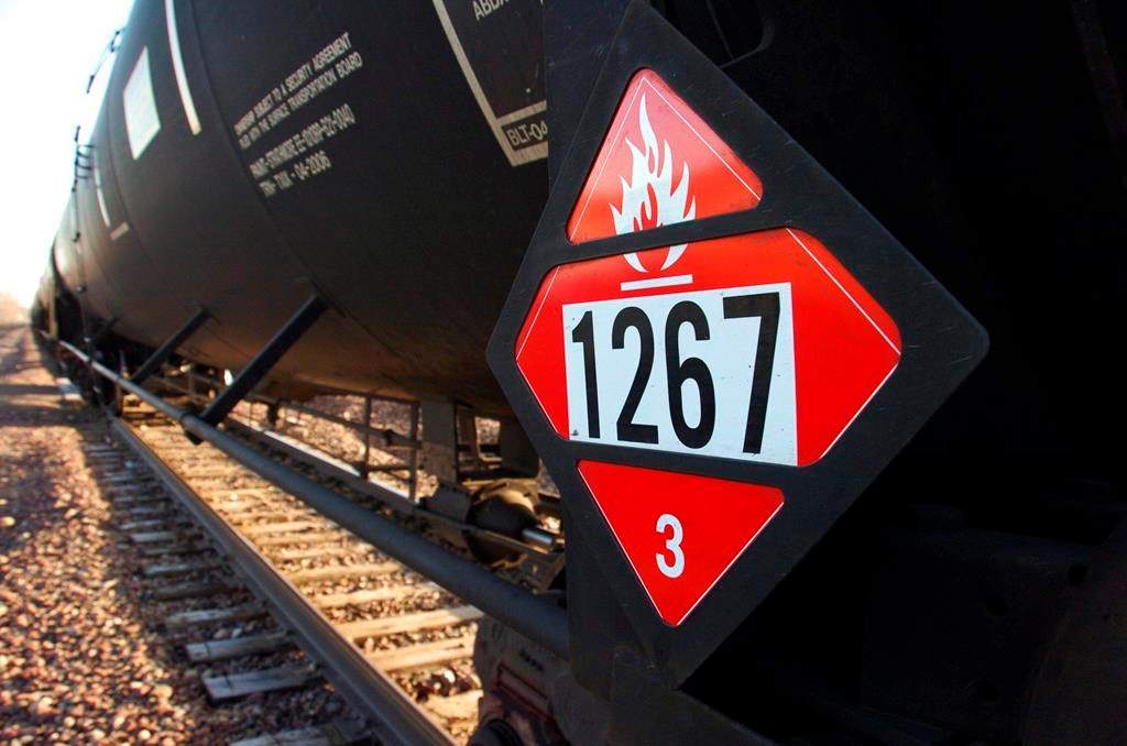 A warning placard is seen on a tank car carrying crude oil near a loading terminal in Trenton, N.D., on Wednesday, Nov. 6, 2013.