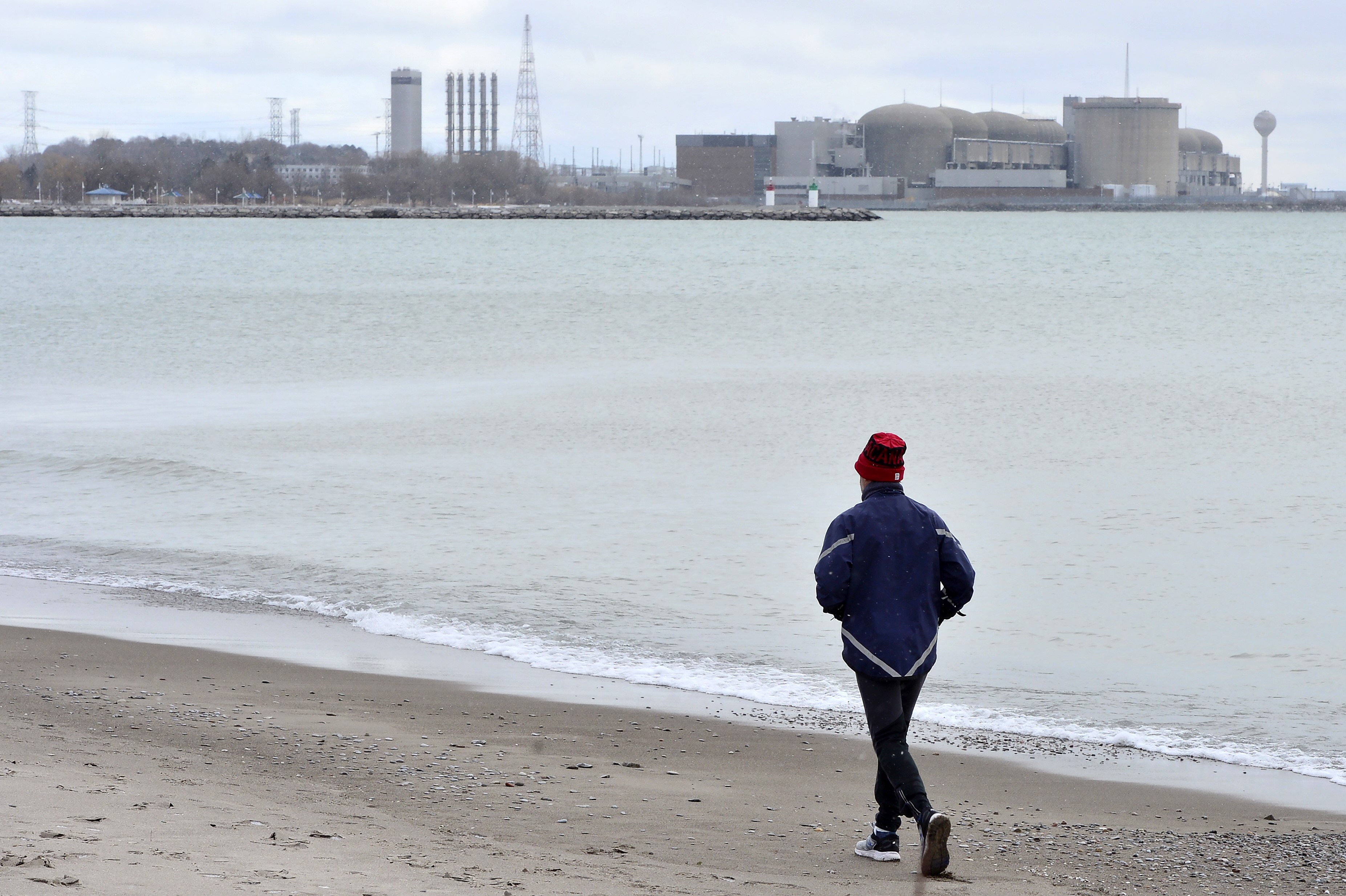 An alert warning Ontario residents of an unspecified incident at the Pickering Nuclear Generating Station early Sunday morning was sent in error, Ontario Power Generation said. OPG sent out a tweet about 40 minutes after the emergency alert, which was pushed to cellphones at about 7:30 a.m., saying it was a mistake. A jogger runs along the beach past the Pickering Nuclear Generating Station, in Pickering, Ont., Sunday, Jan. 12, 2020. 