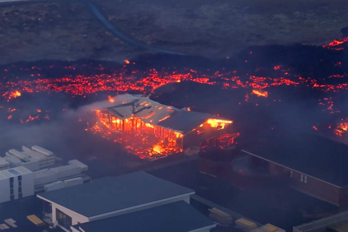 Volcanic activity is seen in Grindavik, Iceland, Sunday, Jan. 14, 2024. Iceland’s president says the country is battling “tremendous forces of nature” after molten lava from a volcano consumed several houses in the evacuated town of Grindavik.