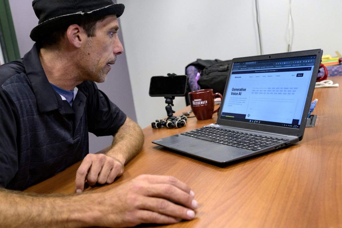 Paul Carpenter, a New Orleans magician, describes using his computer and AI software during an interview in New Orleans, Friday, Feb. 23, 2024. Carpenter says he was hired in January by Steve Kramer, who has worked on ballot access for Democratic presidential candidate Dean Phillips, to use AI software to imitate President Joe Biden’s voice to convince New Hampshire Democrat voters not to vote in the state’s presidential primary. (AP Photo/Matthew Hinton)