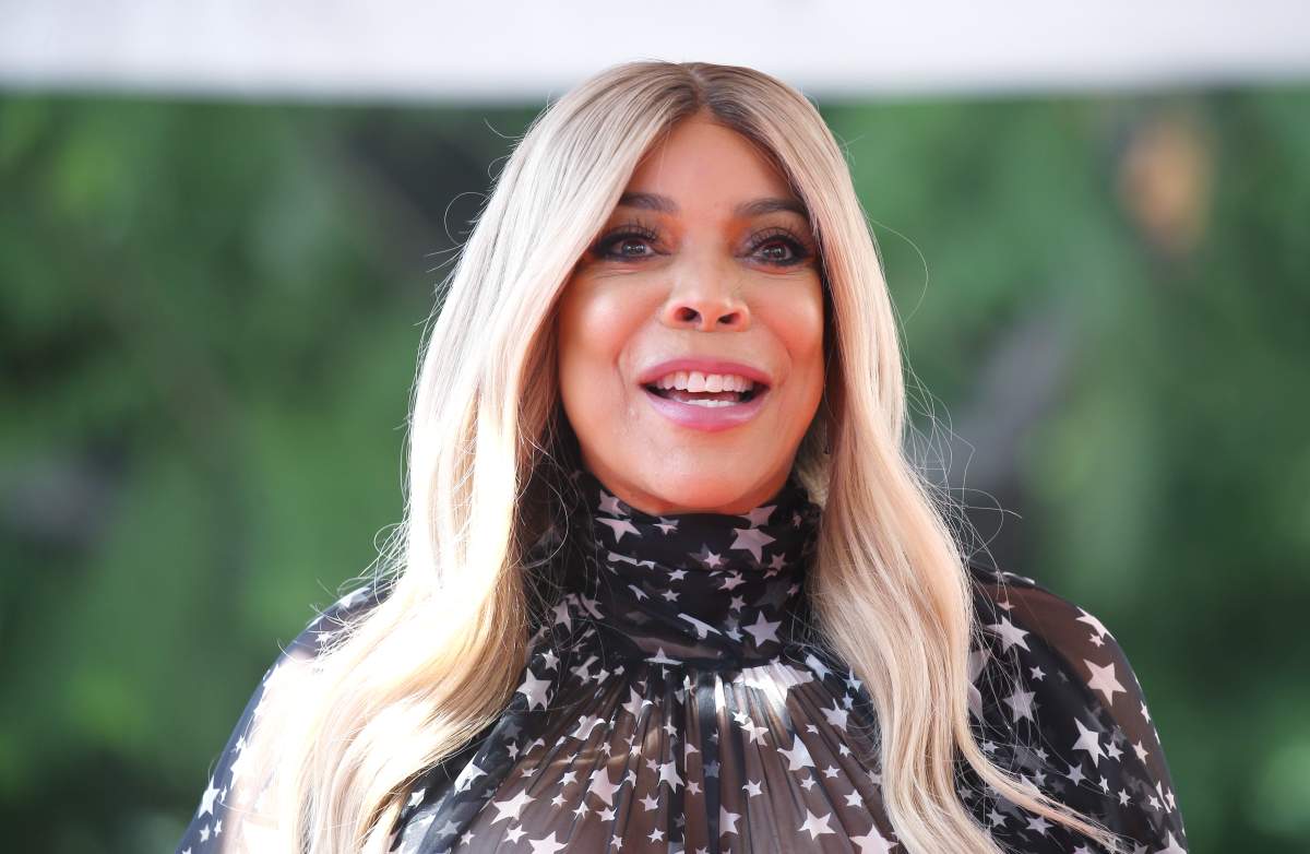 Wendy Williams. She has blonde hair and a black dress.