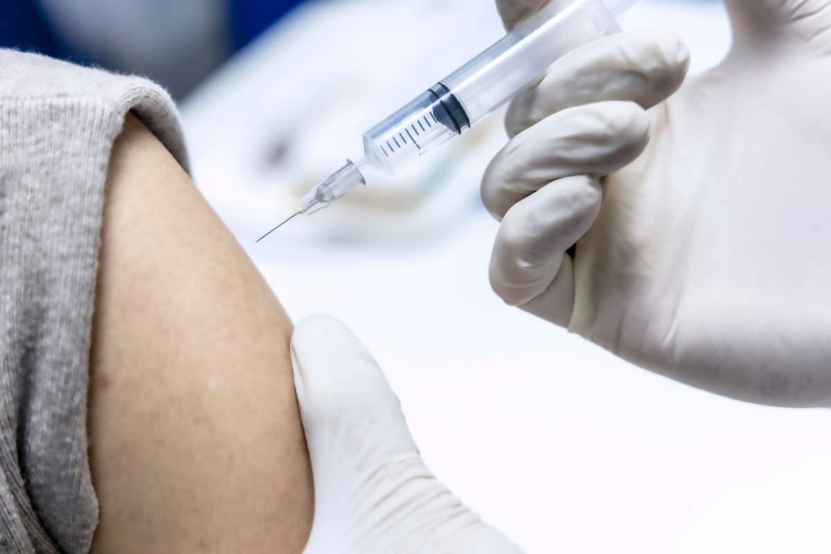 The doctor is giving a vaccination
