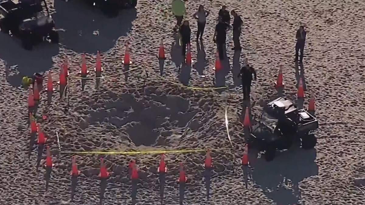 Aerial image of a sand hole that suddenly collapsed and pulled two young children in.