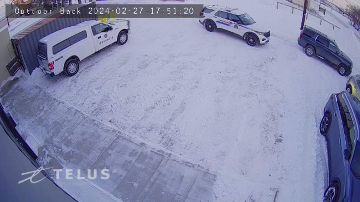 RCMP outside an apartment building in Wainwright, Alta. on Tuesday, Feb. 27, 2024.